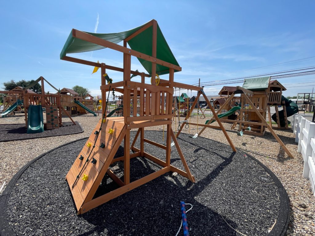 swing set with climbing wall