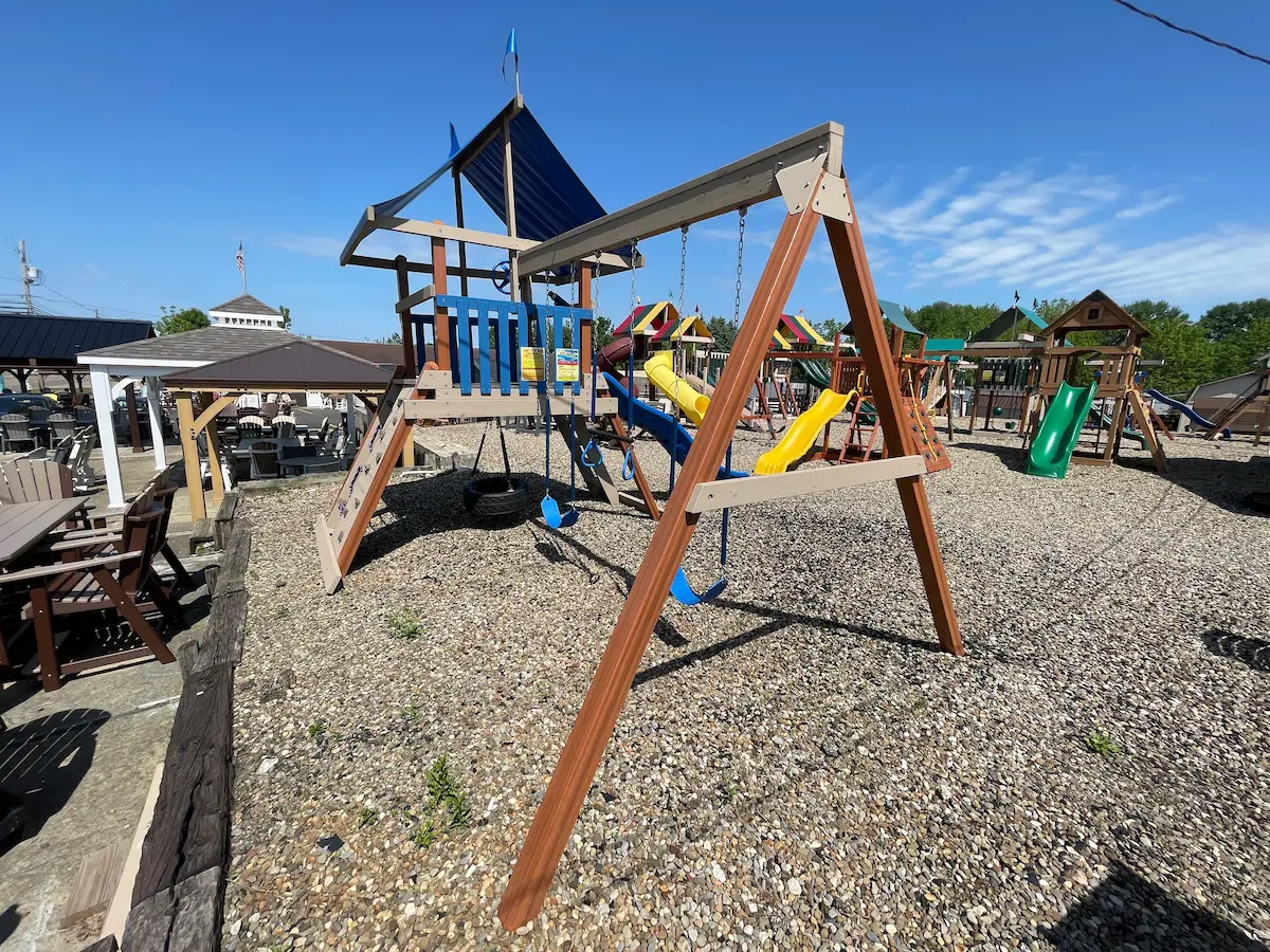 outdoor swing set with blue slide
