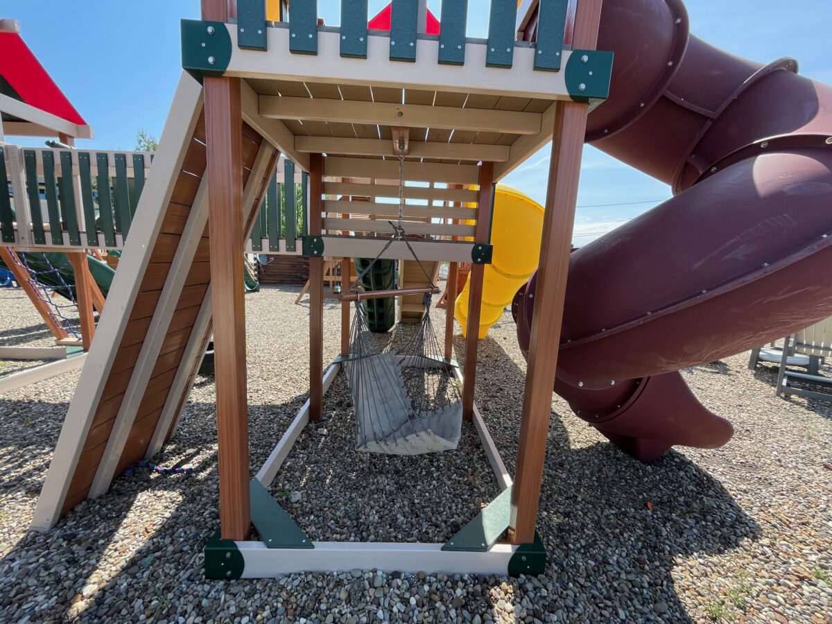 wooden playground with monkey bars