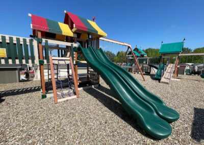 wooden playground with multiple slides