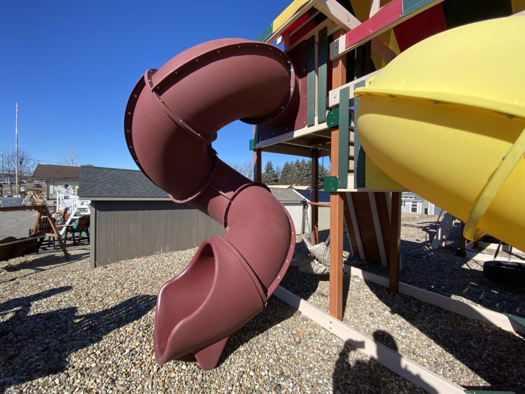 wooden playground with tube slide