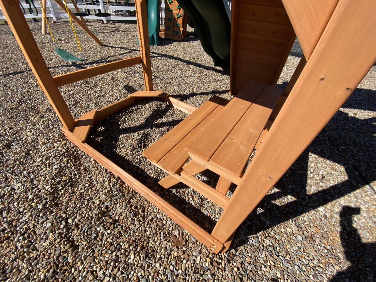 playhouse swing set combo and seating area