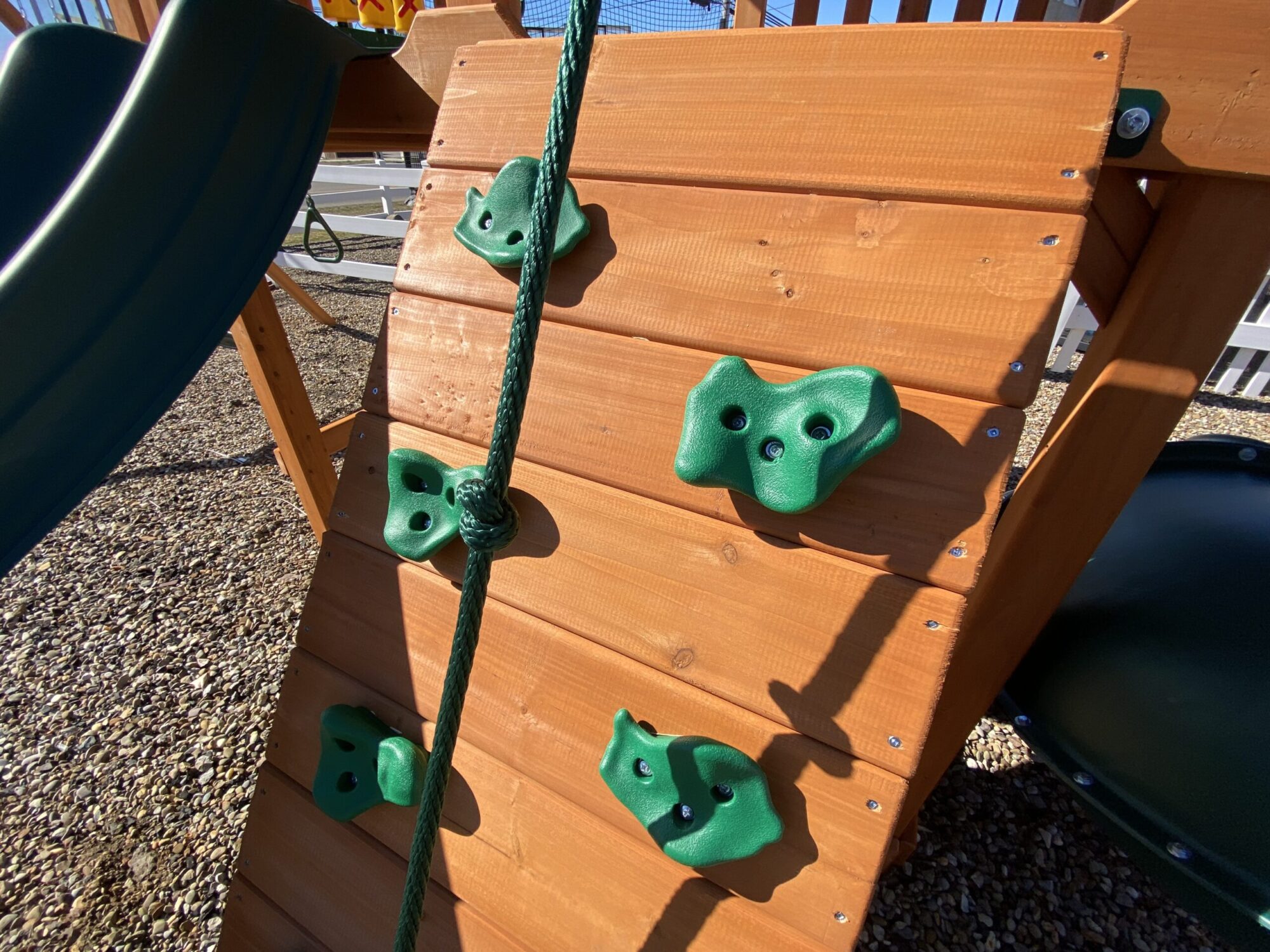 swing set with spiral slide rock climbers