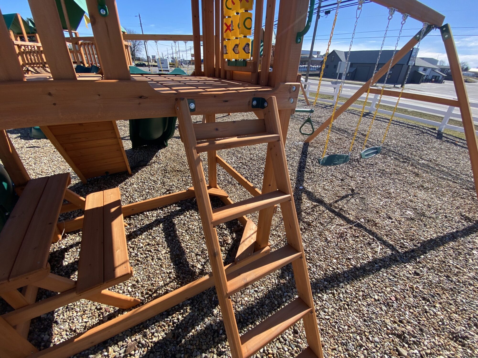 swing set with spiral slide with ladder entry