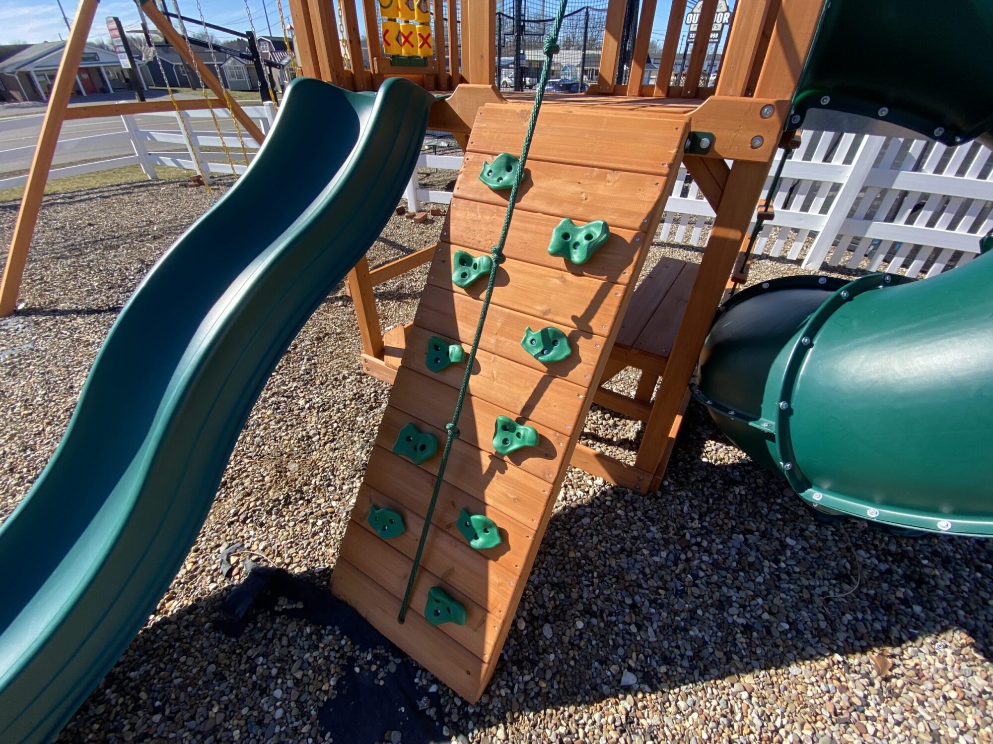 swing set with spiral slide with rock climbing