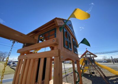 swing set with tube slide with flags