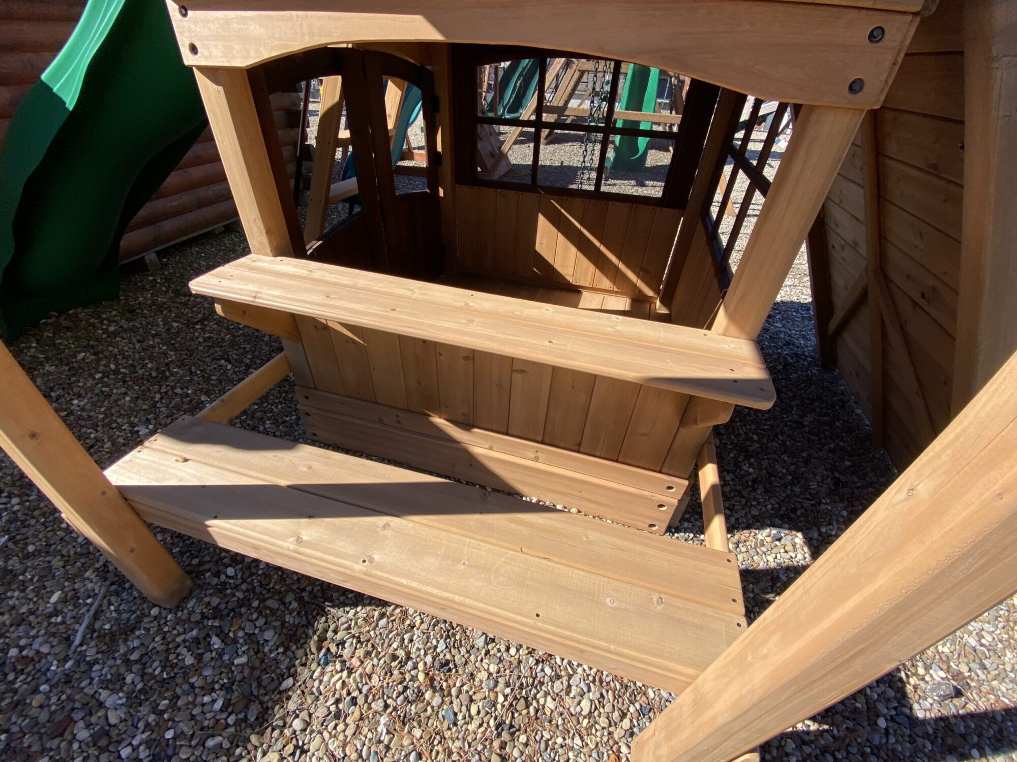 wooden swing set with slide and table